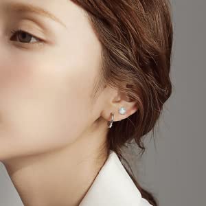 Define the shape and curves of silver earrings.
